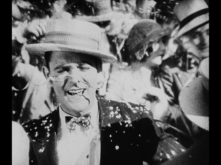 Medium shot of Jim in a throng of people