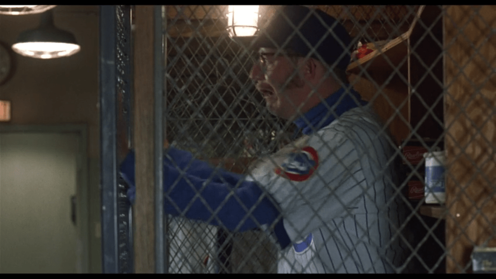 Medium shot of Brickma inside a cage