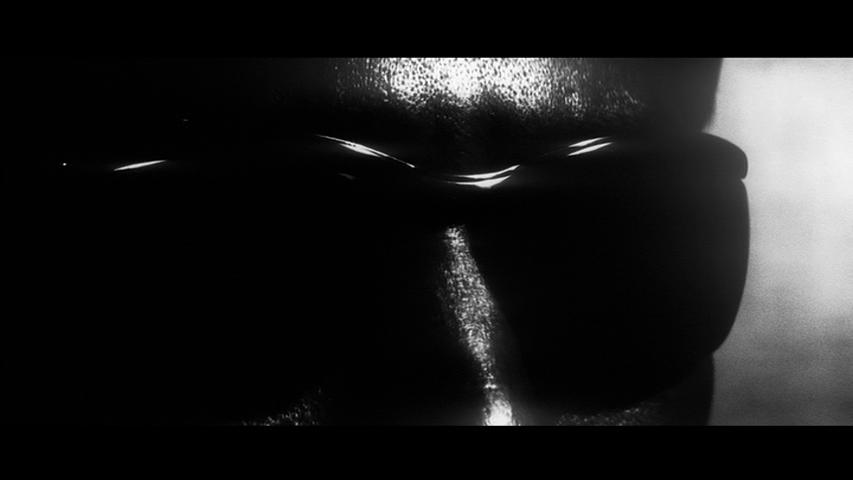 Extreme close-up of Otsuka wearing sunglasses