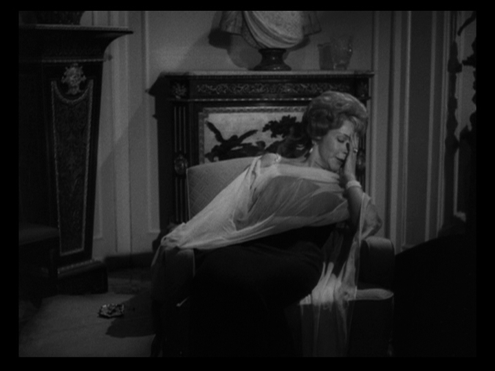 Medium shot of someone getting ready to sleep in a chair