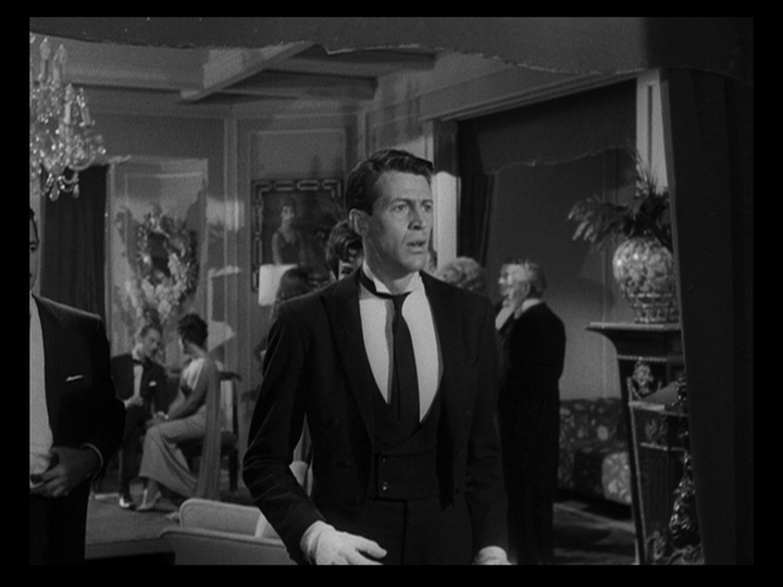 Medium shot of Julio looking straight ahead to the right with an anguished expression on his face