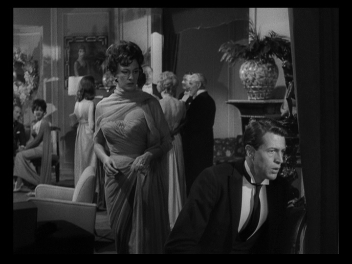 Medium shot of Lucía looking at Julio as he crumples to the ground