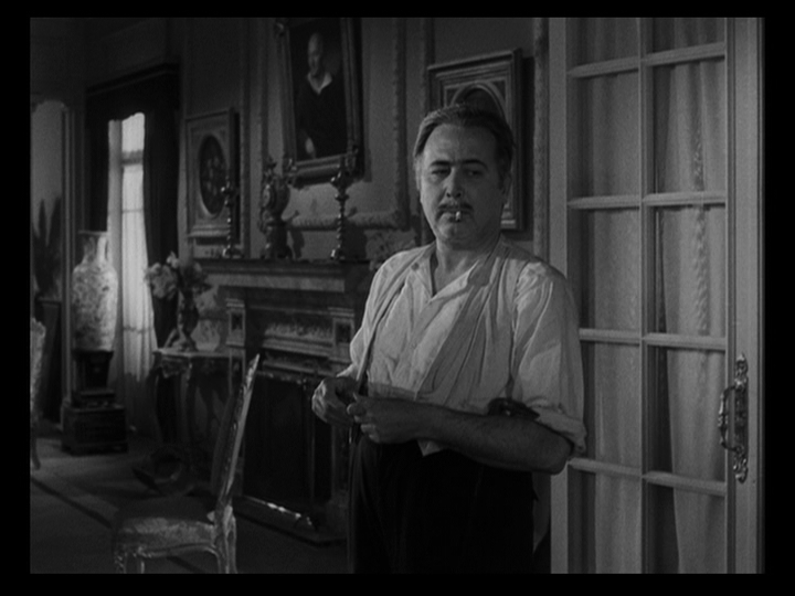 Medium shot of a Raul (Tito Junco) looking around to make sure no one is watching him