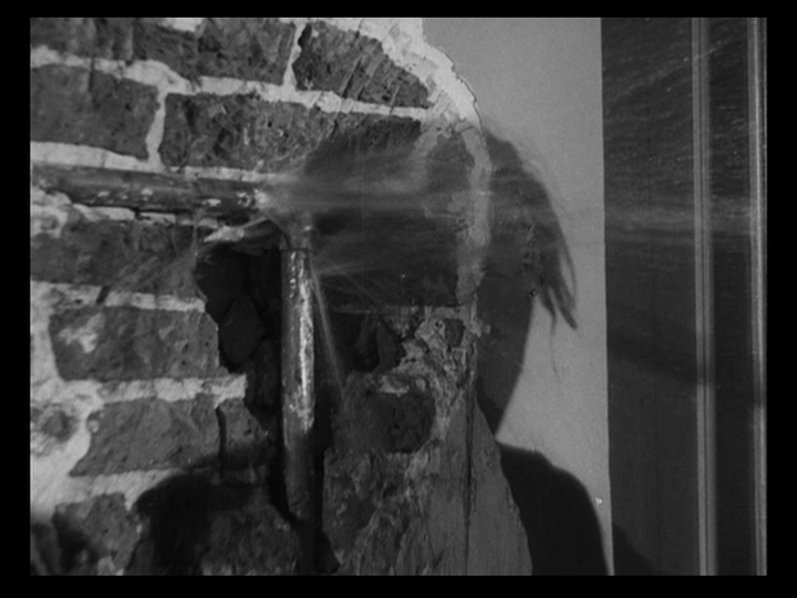 Close-up of a punctured pipe gushing water