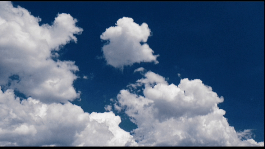 Time-lapse image of clouds moving across the sky from the opening credits sequence for The Happening