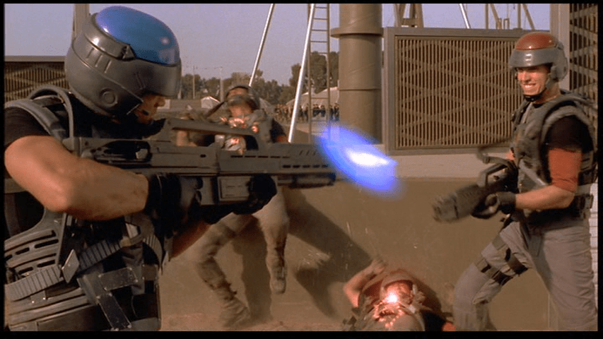 Medium long shot of Johnny defeating his red team opponents in a capture the flag game