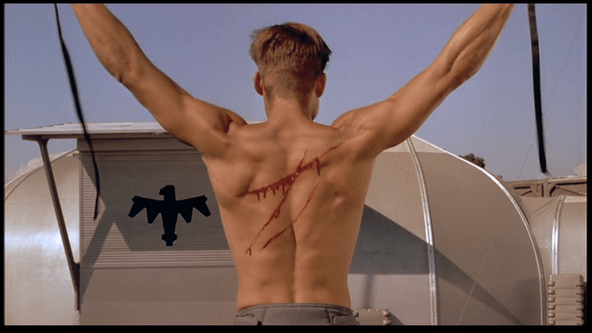 Medium shot of Johnny's shirtless back, which is bleeding from where he has been flogged