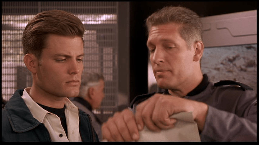 Medium shot of Sgt. Zim standing next to Johnny and tearing up his letter of resignation