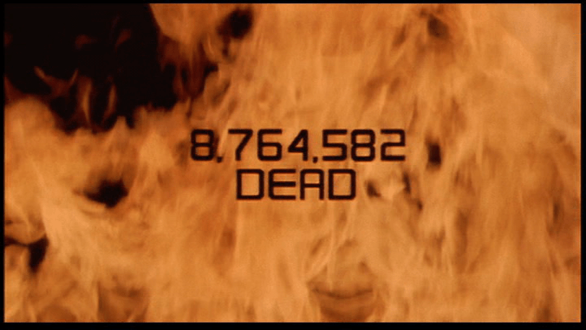 Continuation of the previous shot: a title reading "8,764,582 dead" now appears over a screen otherwise completely covered by flames