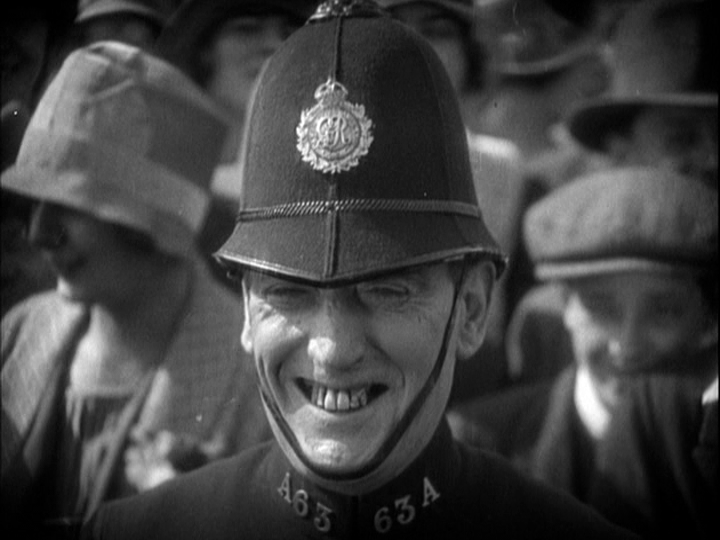 Close-up of a police officer laughing