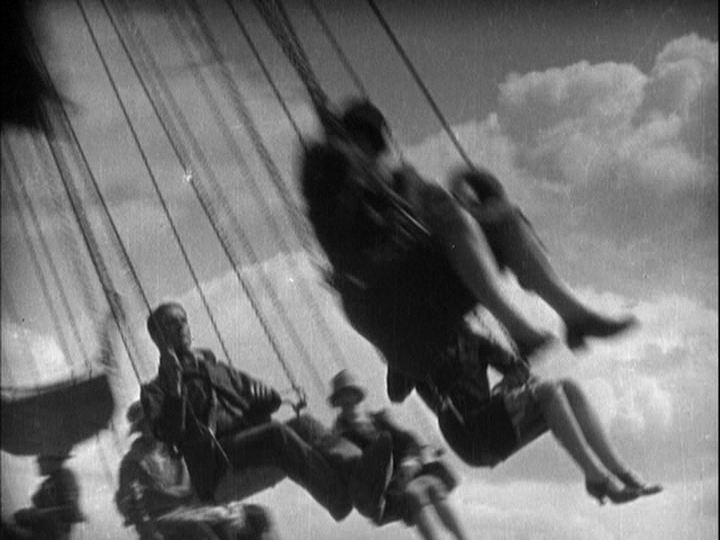 Medium shot of children on a swing ride