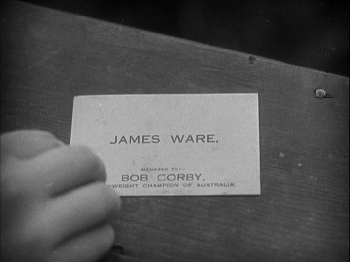 Close up of a business card that reads "James Ware, manager to Bob Corby, heavyweight champion of Australia"