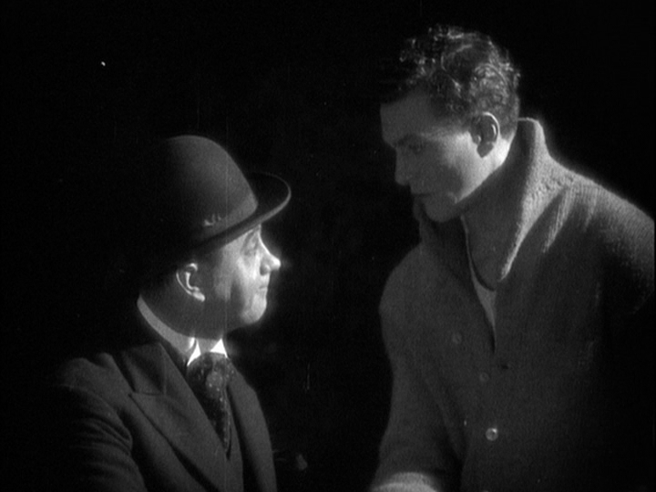 Medium shot of Corby's manager shaking hands with Sander