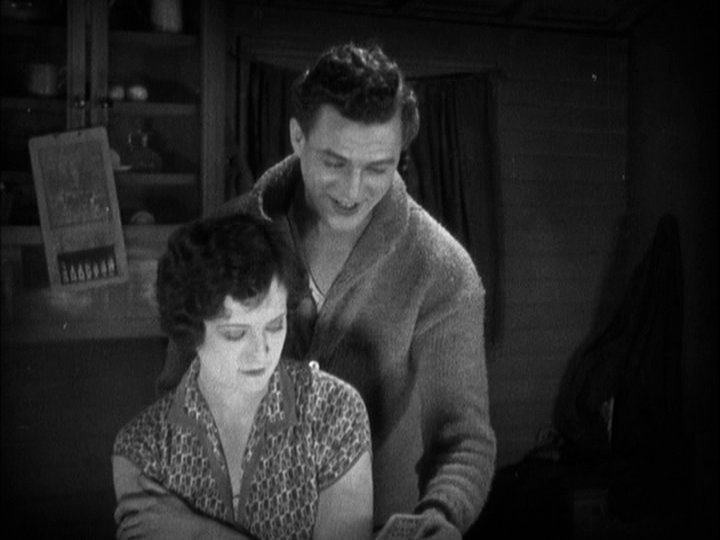 Medium shot of Sander smiling as he contemplates his card