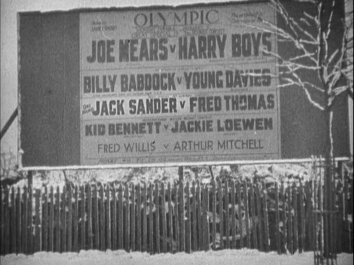 Continuation of the previous shot: the ground is covered in snow and Sander's name is bigger still