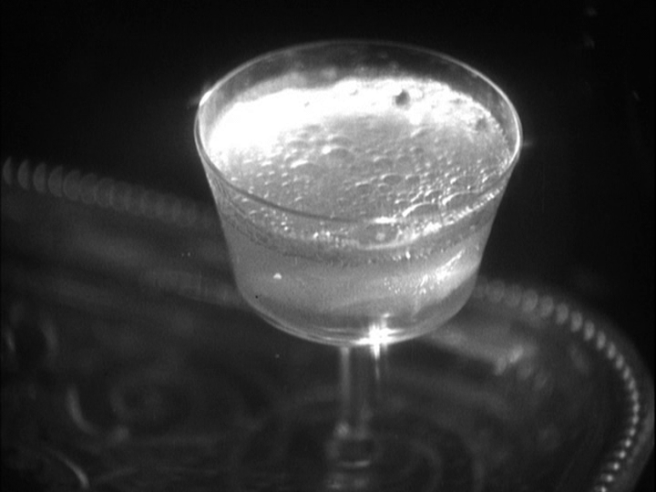 Close-up of a very effervescent glass of champagne