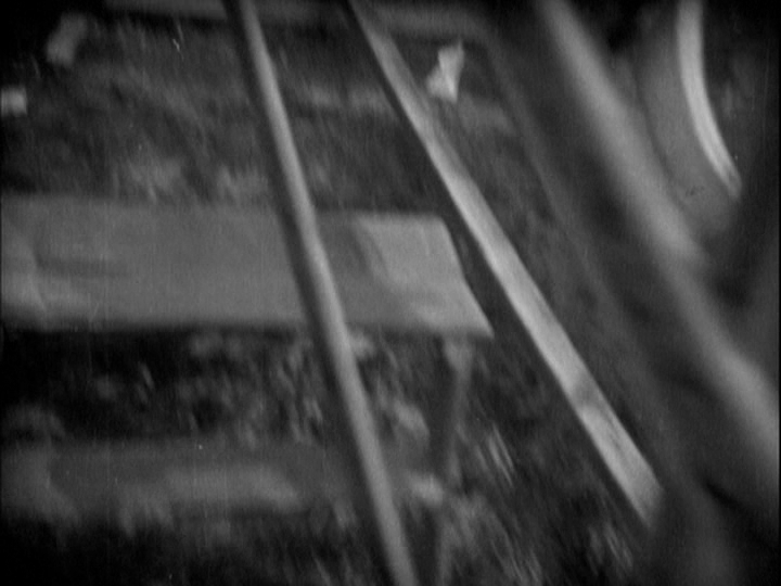 Blurry overhead point-of-view shot of the ground from the perspective of the woman in the previous image