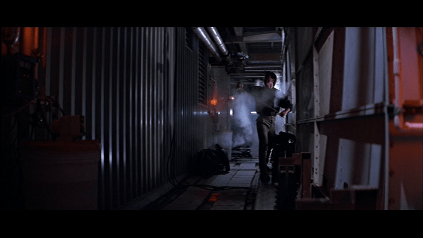 Long shot of Marco (
Lorenzo Caccialanza) pulling on a length of the wire from the previous image