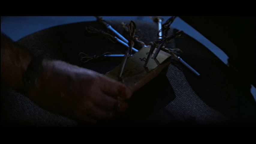 Close-up of McClane preparing his bomb