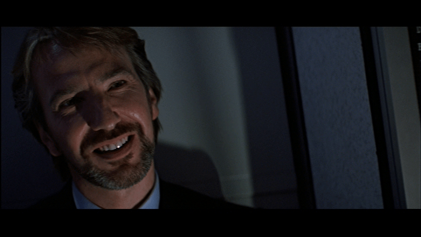 Close-up of Gruber smiling from the left third of the frame and shot so that he tilts to the left