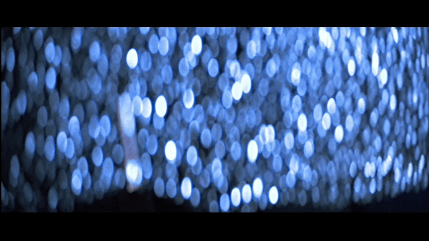 Falling glass fills the screen like blue diamonds