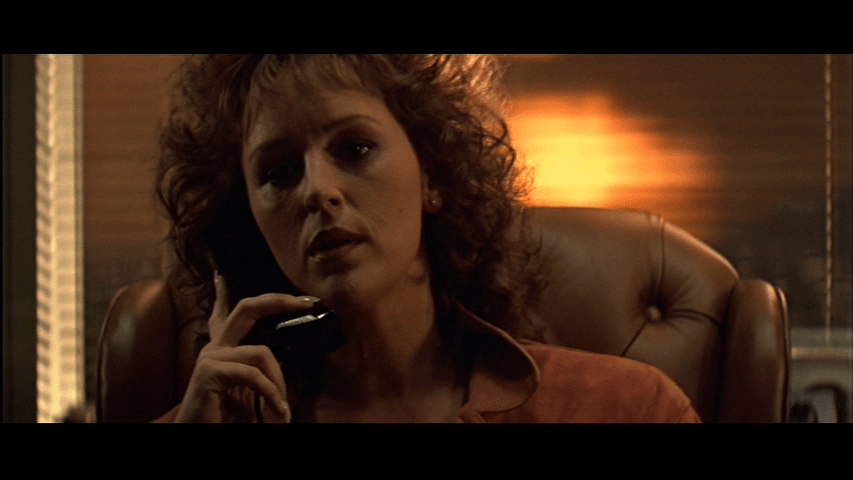 Continuation of the previous shot: Holly is now in focus facing the camera and occupies the entire frame