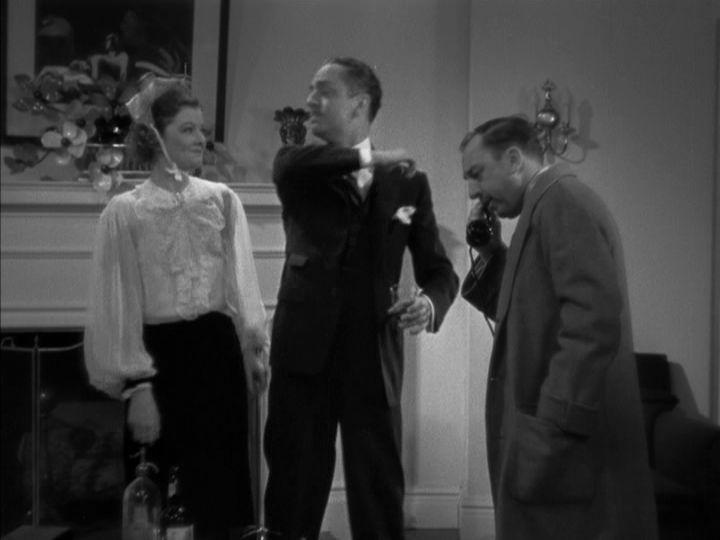 Continuation of the previous image: Nora smiles at Nick as he jokingly raises his arm as though to strike her