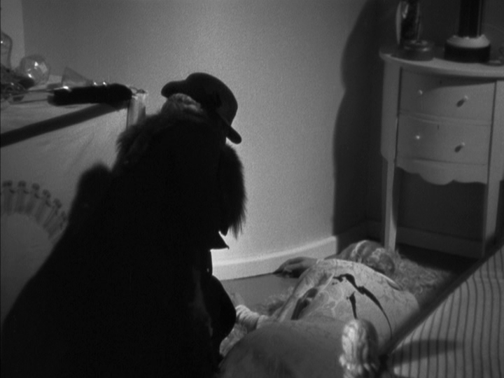 Medium shot of Mimi crouching over Julia Wolf's body