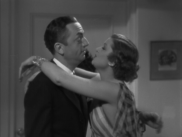 Medium shot of Nora putting her arms around Nick