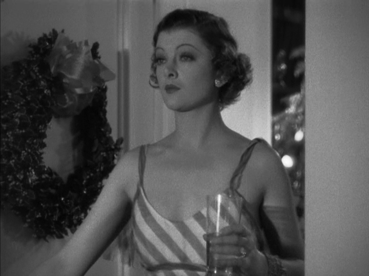 Medium shot of Nora entering her bedroom to see her husband embracing another woman