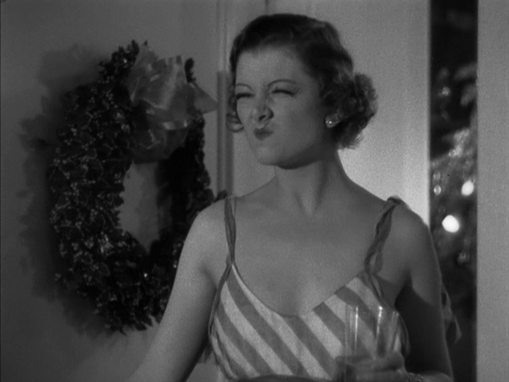 Medium shot of Nora returning Nick's funny face with one of her own