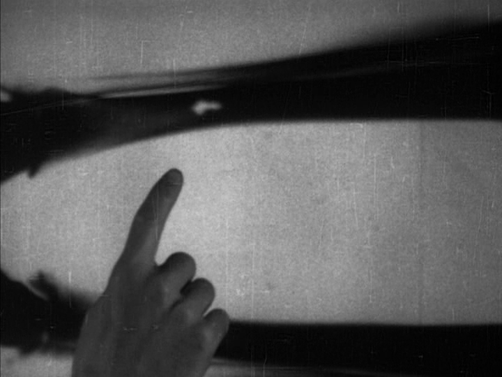 Nick points to a piece of shrapnel embedded in the leg of the skeleton being displayed on a fluoroscope