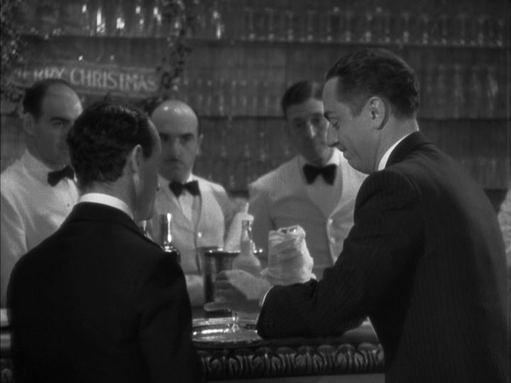 Medium shot of Nick placing a cocktail on a server's tray