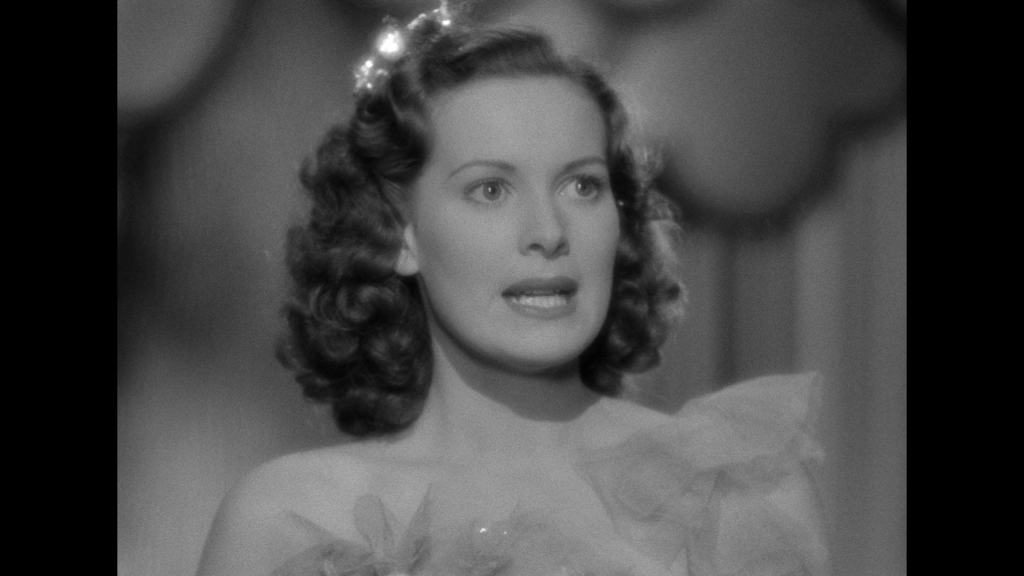 Close-up of Maureen O'Hara looking defiant