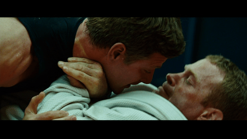 Close-up of Officer Joe, who is now pinned by his opponent