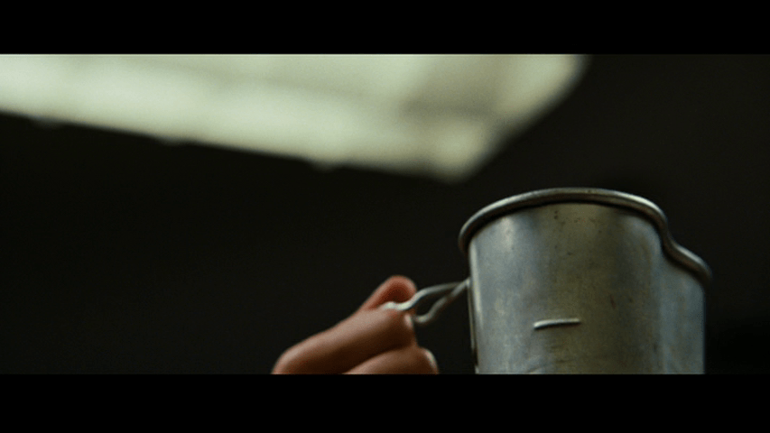 Low-angle close-up of the cup being held aloft