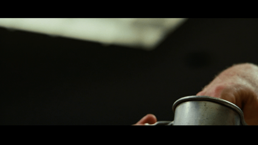 Continuation of the previous shot: a hand reaches into the cup