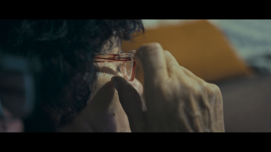 Close-up of Jana Coneva rubbing her eyes as a tear slowly streams down her face