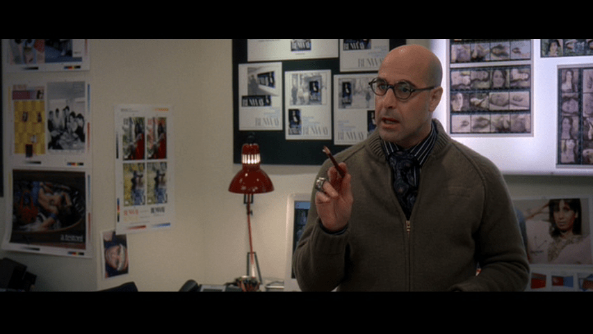 Medium shot of Nigel pointing offscreen left at Andy with a pencil