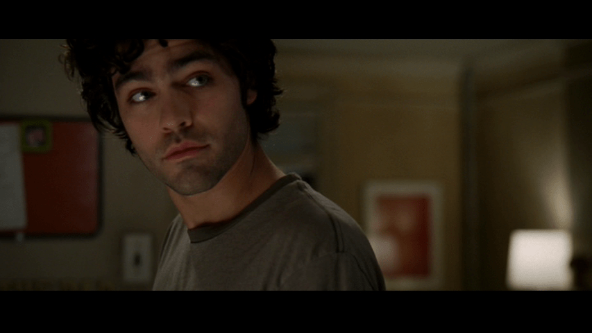 Continuation of the previous image: Nate turns to look offscreen right at Andy