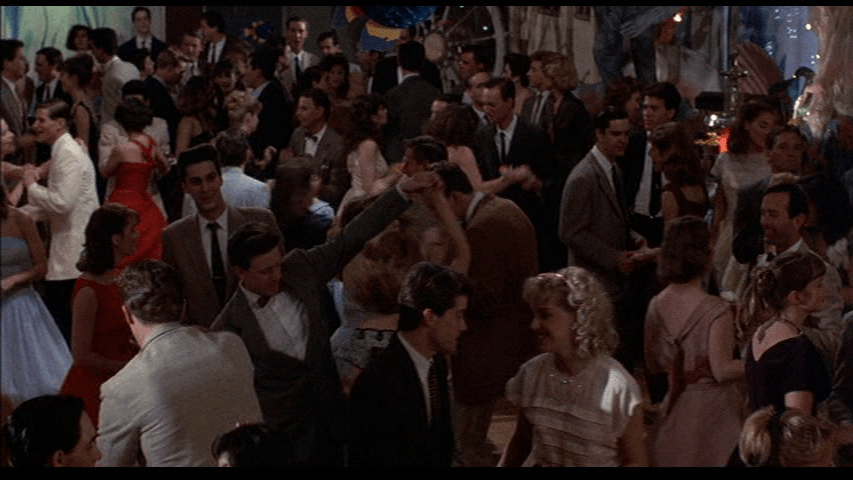 Overhead long shot of the 50s kids grooving to the next big thing 