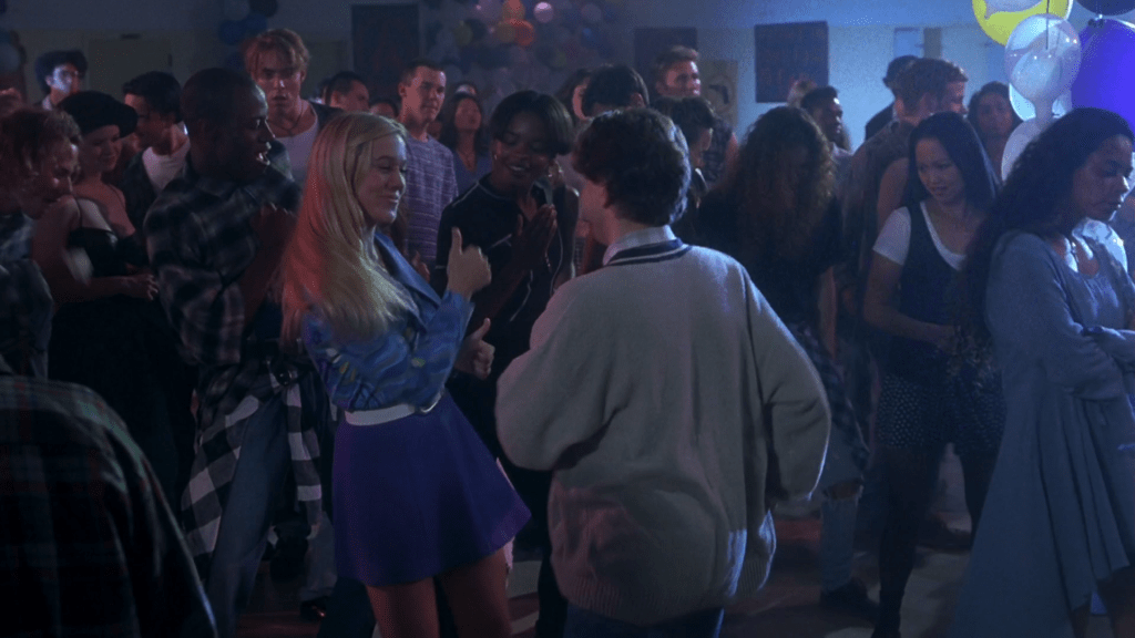 Long shot of Christine Taylor's Marcia Brady showing the 90s kids how they got down in the 70s