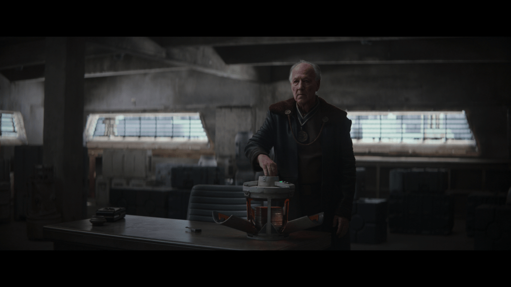 Medium shot of The Client opening a container