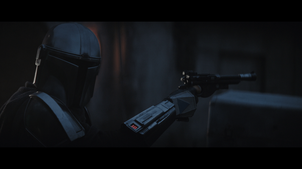 Close-up of the Mandalorian addressing Heavy Infantry, who is offscreen
