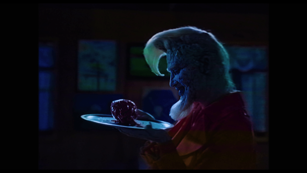 Medium shot of either Marco or Polo carrying Isabel's heart on a silver platter