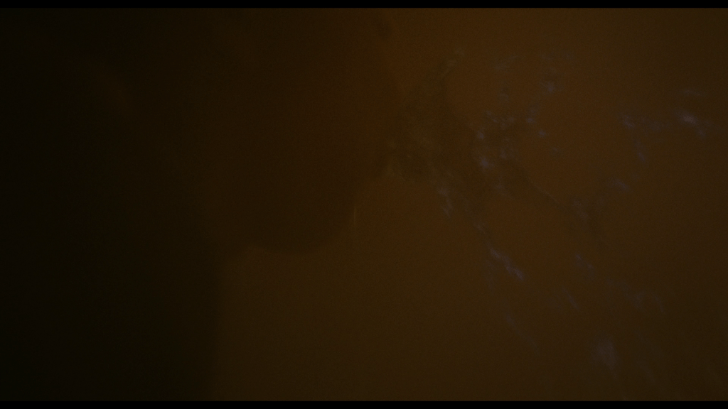 Close-up of Owen vomiting up something blue