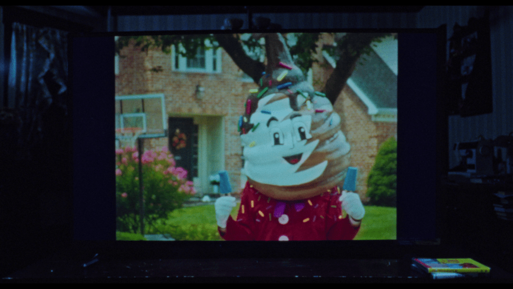 Continuation of the previous images: the soft-serve man's face is now smiling