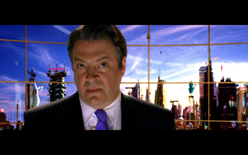 Close-up of Roger Allam's Royalton looking like a classic movie villain