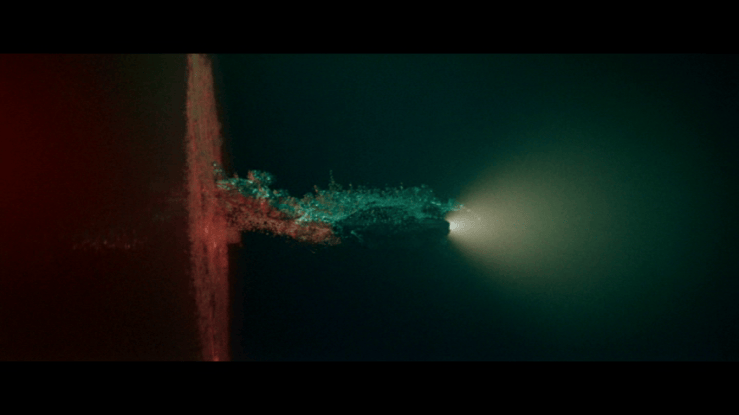 Striking red-green composition showing a car emerging from a "portal" into an underwater landscape lit only by its headlights