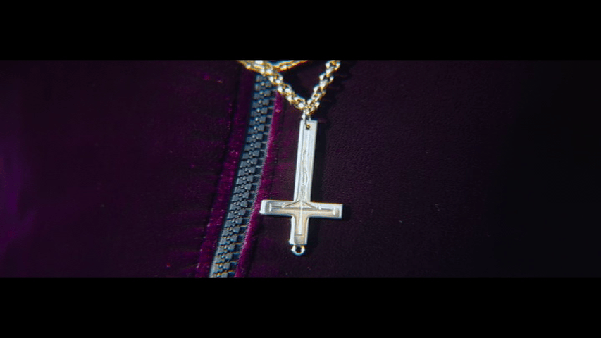 Close-up of an upside down cross pendant